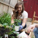 Katie Roselieb plants Bonnie Plants Harvest Select vegetable plants in her raised garden bed. The collection is specifically designed to help home growers have a more successful harvest as more young people start gardens to grow their own fresh food.